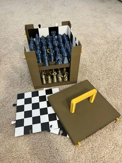 Opening the box: the army waits in its racks, and the board panels travel in the lid.